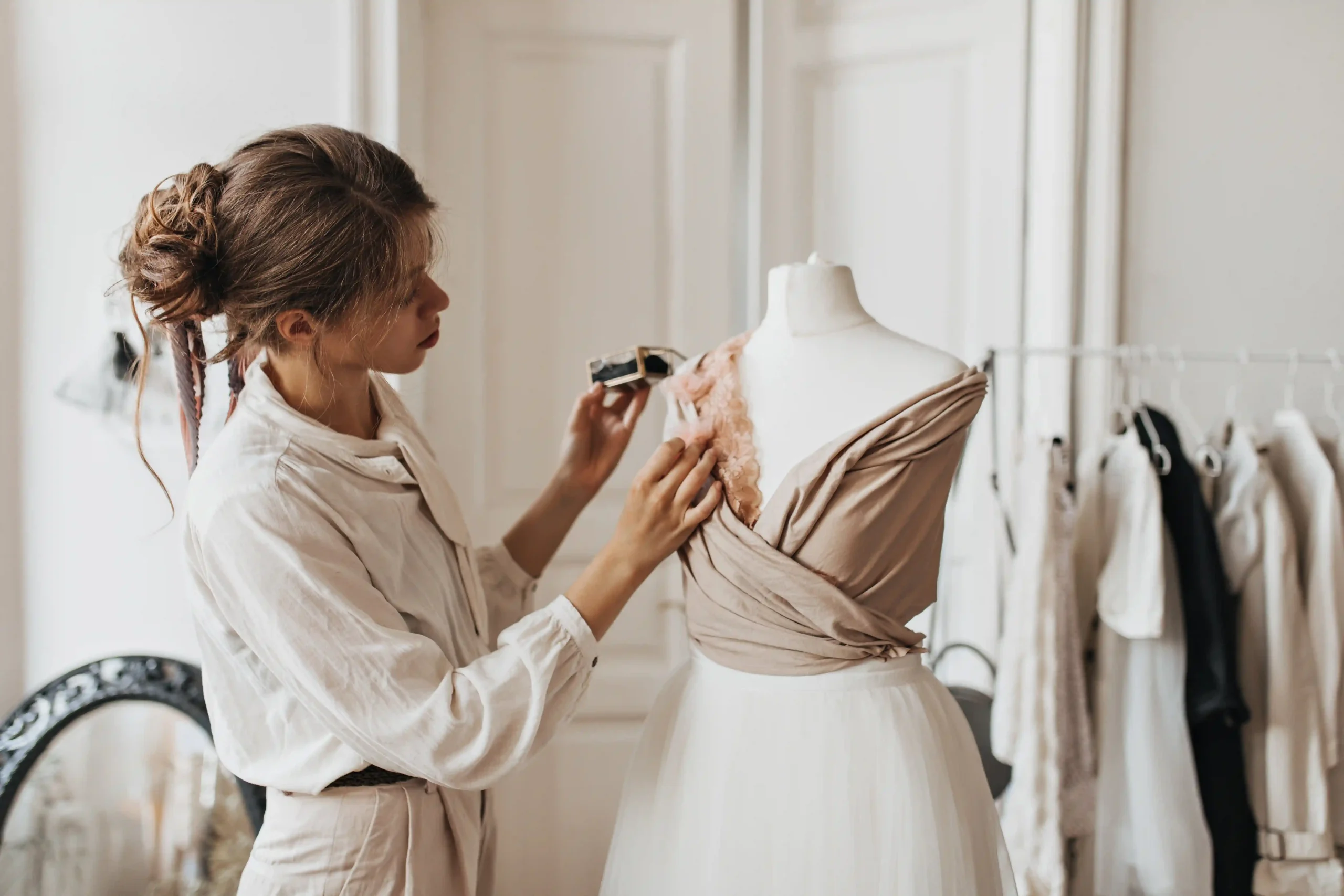 Fashion designer styling a new outfit for a look-book shoot